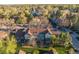 Aerial view of townhomes surrounded by mature trees, offering a serene community setting at 1239 S Flower Cir # C, Lakewood, CO 80232