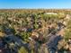 An aerial view showing a charming neighborhood with mature trees, well-maintained streets, and lovely homes at 1239 S Flower Cir # C, Lakewood, CO 80232