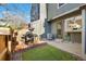 Cozy backyard featuring a patio, grill, and artificial turf, perfect for outdoor entertaining at 1239 S Flower Cir # C, Lakewood, CO 80232