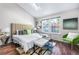 Serene bedroom with skylight, accent pillows, and natural light at 1239 S Flower Cir # C, Lakewood, CO 80232