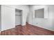 Bedroom with hardwood floors, a closet, a window, and a bright, airy atmosphere at 1239 S Flower Cir # C, Lakewood, CO 80232