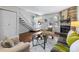 Cozy living room with fireplace and view of the home's entrance at 1239 S Flower Cir # C, Lakewood, CO 80232