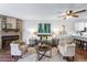 Inviting living room with stone fireplace, ceiling fan, and neutral decor at 1239 S Flower Cir # C, Lakewood, CO 80232