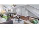 Inviting living room with hardwood floors, a ceiling fan, and seamless access to an open kitchen area at 1239 S Flower Cir # C, Lakewood, CO 80232