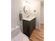 Updated bathroom with modern vanity and tiled backsplash, plus wood-look flooring at 777 N Washington St # 508, Denver, CO 80203