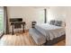 Bedroom with natural light and wood-look flooring. features desk and queen bed at 777 N Washington St # 508, Denver, CO 80203