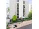 Modern high-rise condo building featuring private balconies, covered entrance, and landscaped grounds at 777 N Washington St # 508, Denver, CO 80203