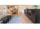 Open-concept living room with hardwood floors and view into kitchen at 777 N Washington St # 508, Denver, CO 80203