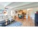Open concept living space with wood floors, dining area, and comfortable sofa at 777 N Washington St # 508, Denver, CO 80203