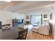 Bright living room featuring a fireplace, exposed beams, and sliding glass doors to the outside at 777 N Washington St # 508, Denver, CO 80203