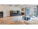 Bright living room featuring hardwood floors, fireplace, and access to balcony at 777 N Washington St # 508, Denver, CO 80203