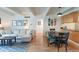 Living room with a decorative rug, comfortable sofa, and an adjacent kitchen area at 777 N Washington St # 508, Denver, CO 80203