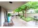 Covered patio with seating area, lush trees, and tranquil outdoor space at 777 N Washington St # 508, Denver, CO 80203