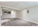 Finished basement featuring neutral walls, plush carpet, and a window at 450 Lone Pine St, Fort Lupton, CO 80621