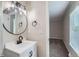 Bathroom featuring a stylish vanity, contemporary fixtures, and a well-lit mirror at 450 Lone Pine St, Fort Lupton, CO 80621