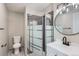 Modern bathroom featuring a sleek vanity, updated fixtures, and a beautifully tiled walk-in shower at 450 Lone Pine St, Fort Lupton, CO 80621