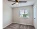 Bright bedroom featuring neutral walls, a ceiling fan, plush carpet, and a window at 450 Lone Pine St, Fort Lupton, CO 80621