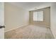 Bedroom featuring neutral walls, carpet flooring, and a window providing ample natural light at 10061 Apollo Bay Way, Highlands Ranch, CO 80130