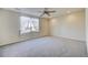 Spacious room with neutral carpet, ceiling fan and lots of natural light at 10061 Apollo Bay Way, Highlands Ranch, CO 80130