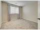Bedroom showcasing ample space, a neutral color scheme, and a window offering natural light at 10061 Apollo Bay Way, Highlands Ranch, CO 80130