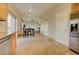 Eat-in kitchen with stainless steel appliances, tile floors, and adjacent dining area at 10061 Apollo Bay Way, Highlands Ranch, CO 80130