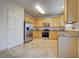 Spacious kitchen featuring stainless steel appliances and ample wood cabinets at 10061 Apollo Bay Way, Highlands Ranch, CO 80130
