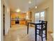Well-lit kitchen with tile floors, ample countertop space, and a view to the back yard at 10061 Apollo Bay Way, Highlands Ranch, CO 80130
