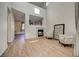 Spacious living room featuring vaulted ceilings, a cozy fireplace, and modern flooring at 10061 Apollo Bay Way, Highlands Ranch, CO 80130