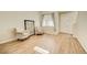 Bright living room with hardwood floors and decoratively framed art piece at 10061 Apollo Bay Way, Highlands Ranch, CO 80130
