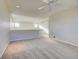 Spacious loft space with neutral carpet, neutral walls, and ceiling fan at 10061 Apollo Bay Way, Highlands Ranch, CO 80130