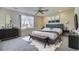 Tastefully decorated main bedroom with neutral walls, ceiling fan, and a large window at 10061 Apollo Bay Way, Highlands Ranch, CO 80130