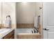 Elegant bathroom showcasing a soaking tub and classic fixtures at 4473 Echo Dr, Larkspur, CO 80118