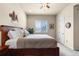 Inviting bedroom featuring a ceiling fan and a cozy, neutral-toned design at 4473 Echo Dr, Larkspur, CO 80118