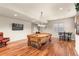 Recreation room features a rustic pool table, a flat screen television and hardwood floors at 4473 Echo Dr, Larkspur, CO 80118