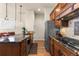 Beautiful kitchen features stainless steel appliances, granite countertops, and custom cabinetry at 4473 Echo Dr, Larkspur, CO 80118