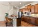 Stylish kitchen featuring granite countertops, stainless steel appliances, and hardwood floors at 4473 Echo Dr, Larkspur, CO 80118