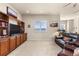 Comfortable living room with built-in shelving, entertainment center, and soft carpet at 4473 Echo Dr, Larkspur, CO 80118