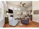 Spacious living room with vaulted ceilings, a fireplace, and plantation shutters at 4473 Echo Dr, Larkspur, CO 80118