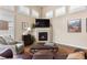 Cozy living room with fireplace, providing a relaxing and inviting atmosphere at 4473 Echo Dr, Larkspur, CO 80118