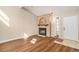 Bright living room with fireplace, wood floors, vaulted ceilings, and natural light creating a cozy and inviting space at 1212 Madero St, Broomfield, CO 80020