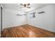 Simple bedroom with hardwood floors and a ceiling fan at 7038 Otis Ct, Arvada, CO 80003