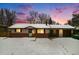 Charming ranch home with attached garage, nestled on a snow-covered lot at 7038 Otis Ct, Arvada, CO 80003