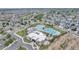 Stunning aerial view of the community pool and clubhouse, surrounded by lush landscaping and neighborhood homes at 4589 Quandary Peak St, Brighton, CO 80601