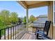 Relaxing balcony featuring a comfortable rocking chair and scenic neighborhood views at 4589 Quandary Peak St, Brighton, CO 80601