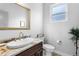 Modern bathroom features granite countertop, decorative mirror and fixtures, and neutral colors at 4589 Quandary Peak St, Brighton, CO 80601