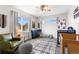Cozy Bedroom with neutral tones, a crib, and a comfortable armchair at 4589 Quandary Peak St, Brighton, CO 80601