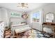 Bright bedroom with a colorful rug, large window and cute decor, perfect for a or guest room at 4589 Quandary Peak St, Brighton, CO 80601