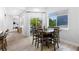 Bright dining area featuring a wooden table, chairs, and natural light from sliding glass doors at 4589 Quandary Peak St, Brighton, CO 80601
