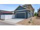 Home exterior featuring a wide driveway and attached garage, for convenient parking at 4589 Quandary Peak St, Brighton, CO 80601