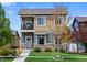 Charming two-story home with a cozy front porch and well-manicured lawn and inviting curb appeal at 4589 Quandary Peak St, Brighton, CO 80601